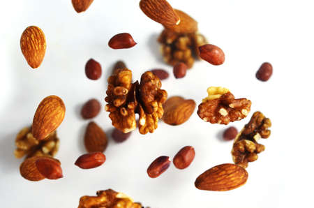 Nuts in the air on a white background, flying nuts. Healthy Brain Food, Diet, Protein, Almonds, walnuts and hazelnuts peanutの写真素材