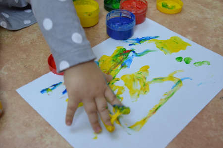 Fresh strawberries in a bowl on wooden table with low key scene.の写真素材