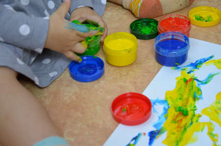 Fresh strawberries in a bowl on wooden table with low key scene.の写真素材