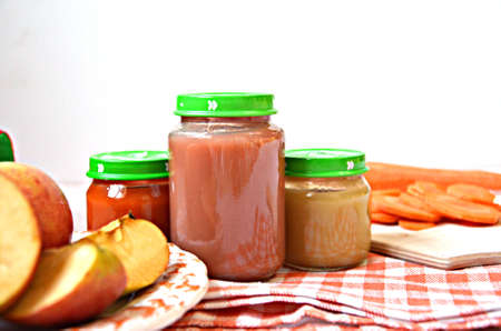 baby food, baby mashed in a glass jar, sliced carrot slices,の写真素材