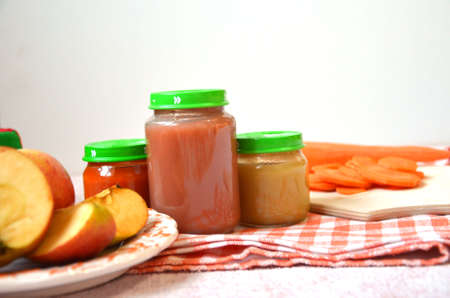 baby food, baby mashed in a glass jar, sliced carrot slices, appleの写真素材