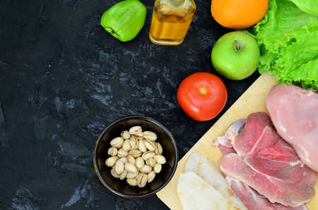 Healthy eating food low carb keto ketogenic diet meal plan protein fat. Fresh meat, fish, mushrooms, nuts. Calorie notepad. diet, detox, keto diet. healthy food. proper nutrition, healthy lifestyleの写真素材