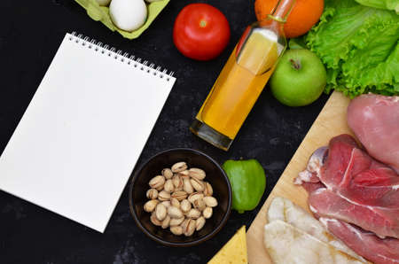 Healthy eating food low carb keto ketogenic diet meal plan protein fat. Fresh meat, fish, mushrooms, nuts. Calorie notepad. diet, detox, keto diet. healthy food. proper nutrition, healthy lifestyleの写真素材