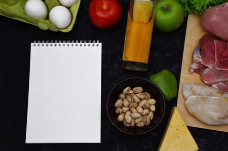 Healthy eating food low carb keto ketogenic diet meal plan protein fat. Fresh meat, fish, mushrooms, nuts. Calorie notepad. diet, detox, keto diet. healthy food. proper nutrition, healthy lifestyleの写真素材