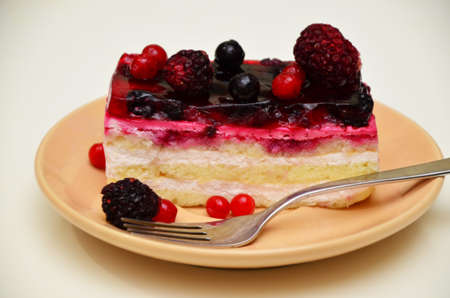 Sweet cakes with berries on table close-up, low-calorie dessert with berries and creamの写真素材