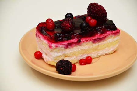 Sweet cakes with berries on table close-up, low-calorie dessert with berries and creamの写真素材