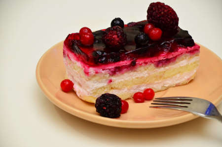 Sweet cakes with berries on table close-up, low-calorie dessert with berries and creamの写真素材