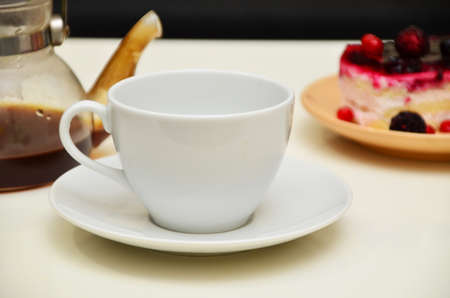 Fruit dessert and coffee. low-calorie dessert with berries and cream. pour coffee and cream into a cupの写真素材