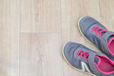 still life of group sports equipment for womens and cardiogram of jump rope. Fitness and healthy living, wellness concept. sneakers, water, sweat, headphones.の写真素材