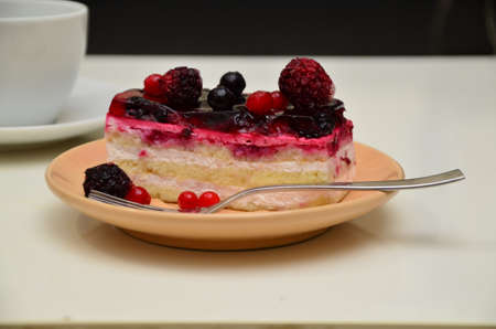 Sweet cakes with berries on table close-up, low-calorie dessert with berries and cream.の写真素材