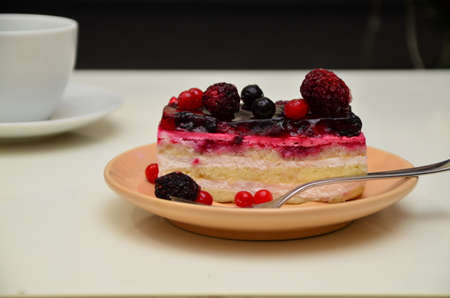 Sweet cakes with berries on table close-up, low-calorie dessert with berries and cream.の写真素材