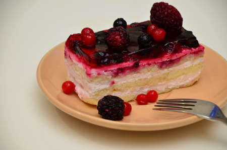 Sweet cakes with berries on table close-up, low-calorie dessert with berries and cream.の写真素材