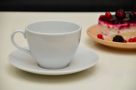 Fruit dessert and coffee low-calorie dessert with berries and cream. pour coffee and cream into a cup.の写真素材