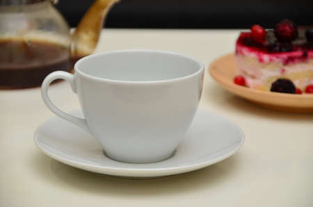 Fruit dessert and coffee low-calorie dessert with berries and cream. pour coffee and cream into a cup.の写真素材