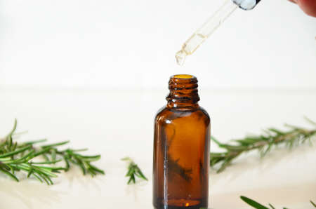 Herbal essential oil on vintage apothecary bottles. Alternative medicine, skin care, aromatherapy and natural medicine.の写真素材