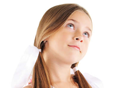 Beauty portrait of little girl with white bows. On white backgroundの写真素材