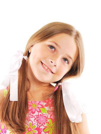 Little blond girl smiling. Isolated on whiteの写真素材