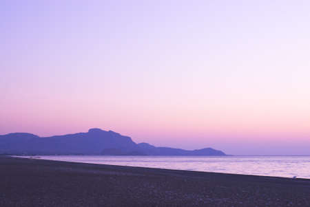 Romantic and colorful sunset on the beachの写真素材