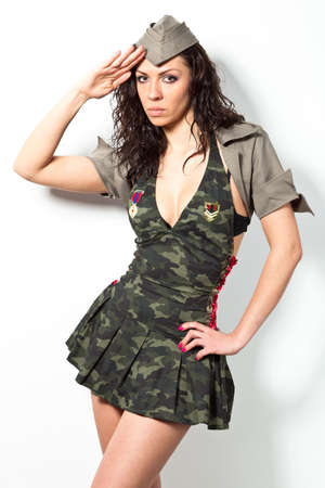 Beautiful girl in military clothes. Studio shotの写真素材