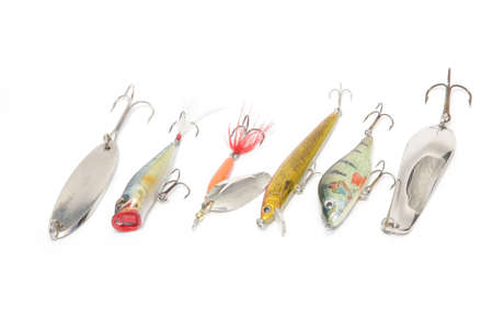 fishing lures of different types on a white backgroundの写真素材
