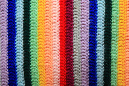 Fabric knitted from woollen threads of different colours. The order of colours was selected by the psychologistの写真素材