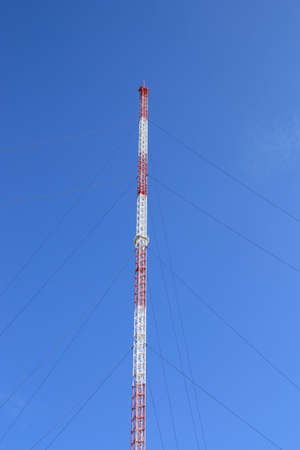 TV-tower under construction on the background of the clear blue sky