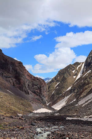 canyon river Azau flowing between the rocks of volcanic origin. Mount Elbrus spurs.