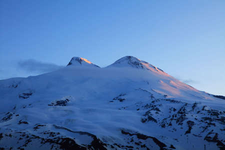 mount Elbrus is an ancient extinct volcano and the highest mountain in Europe. Its height - 5642 m. view from mount Cheget. の写真素材