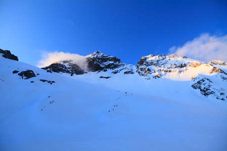 Group of climbers goes to the top of the mount Cheget. Caucasusの写真素材