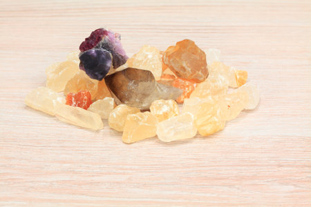 bunch of gems on a wooden background