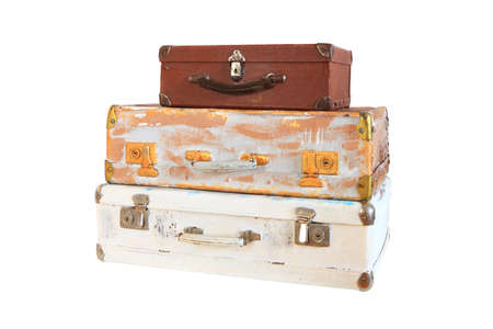 stack of three old suitcases isolated on white backgroundの写真素材