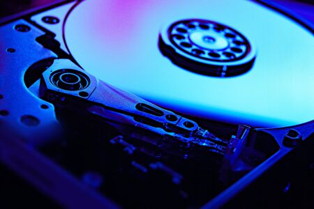 Repear hard disk closeup restore black blue background
