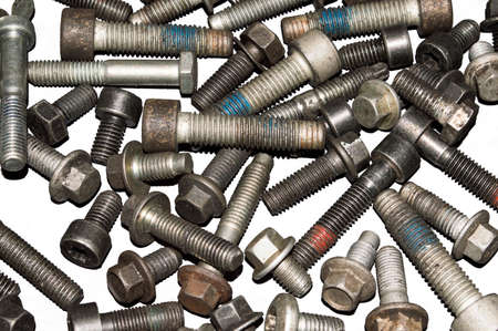 Old metal bolts of various sizes on a white background. Isolate