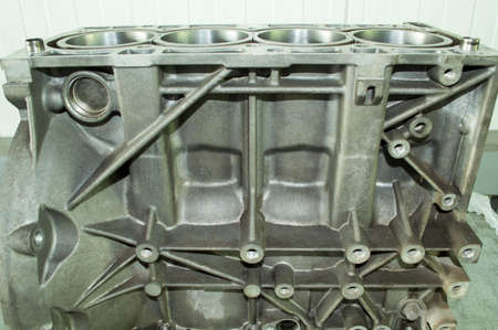 Aluminum cylinder block of automobile internal combustion engine after repair. Four-cylinder. Side...