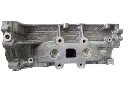 View from the exhaust manifold on the head of the block of a gasoline three-cylinder internal...