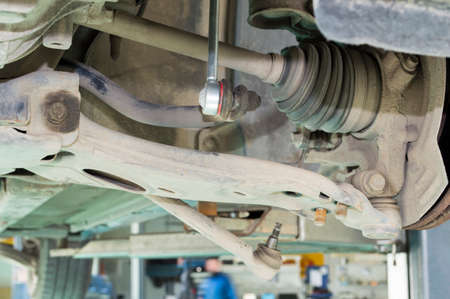 Elements of the car's chassis in the area of the front left wheelの写真素材