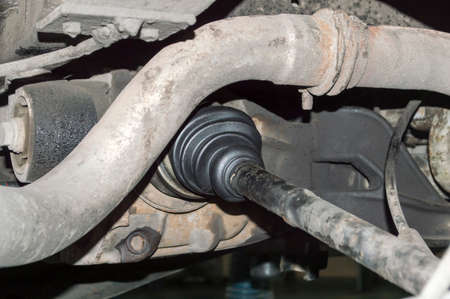 The right half-axle of the rear-wheel drive of an all-wheel drive car located in an auto repair shopの写真素材