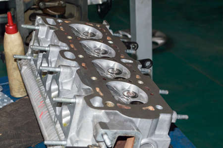 Front view at an angle of the inverted block head of the internal combustion engine, which lies on...