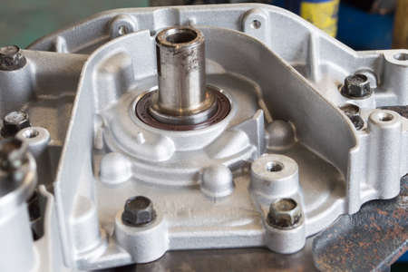 New front oil seal of the crankshaft of an automobile engine mounted on a partially disassembled...