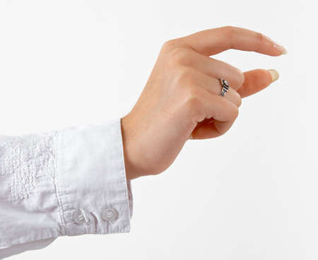 well shaped woman's hand holding something isolated over white