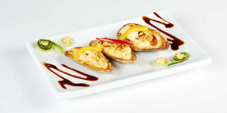 half shell oysters baked  with cheese sauce au gratinの写真素材