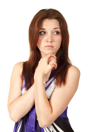 Young beautiful woman holding her hands to her face in sorrowの写真素材
