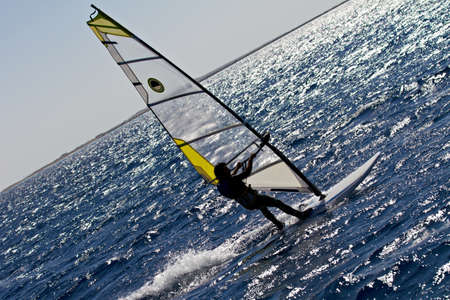 Unidentified man windsurfing in Red Sea waters in Egypt, Safaga, on October 2011の写真素材