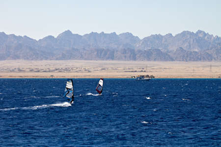 Unidentified men windsurfing in Red Sea waters in Egypt, Safaga, on October 2011の写真素材