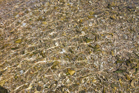 Ocean water motion with sun glints as backgroundの写真素材