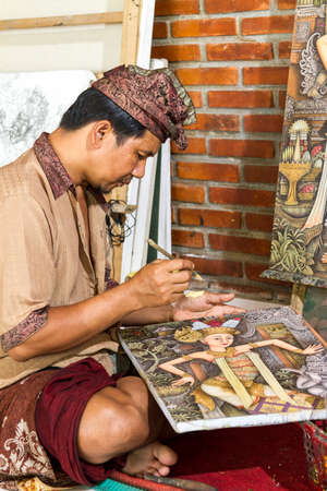 Painter drawing on canvas in gallery, Bali, Indonesiaの写真素材