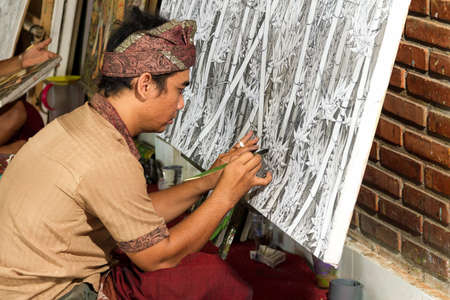 Painter drawing on easel in gallery, Bali, Indonesiaの写真素材