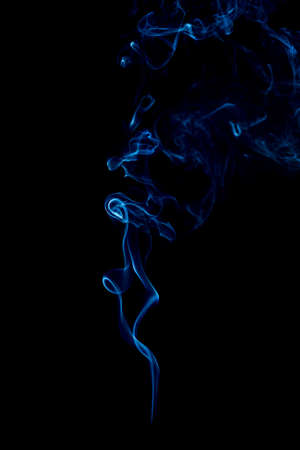 blue rings and curls of smoke on black backgroundの写真素材