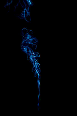 blue rings and curls of smoke on black backgroundの写真素材