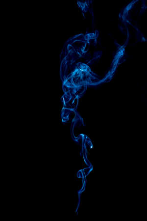 blue rings and curls of smoke on black backgroundの写真素材